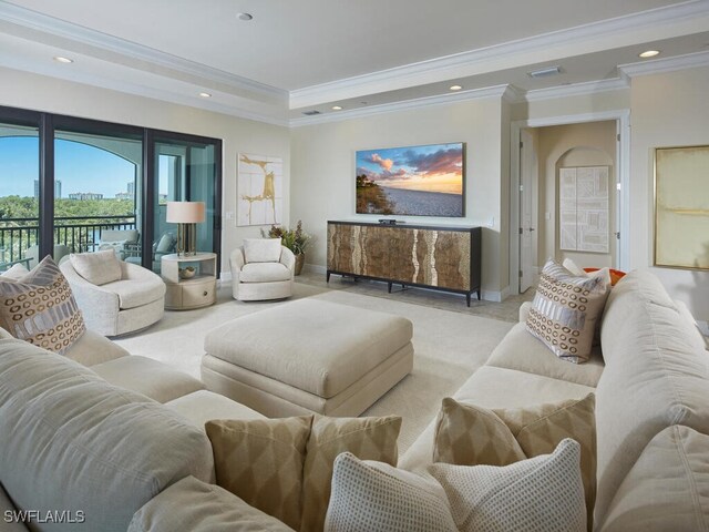 4701 Via Del Corso Ln Unit 401, Bonita Springs, FL 34134 - living room featuring ornamental molding, recessed lighting, a raised ceiling, and light colored carpet