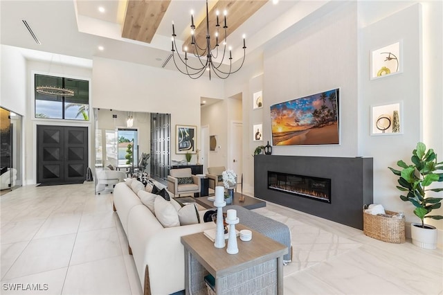 160 SW 52nd Ter, Cape Coral, FL 33914 - living room featuring a towering ceiling and a glass covered fireplace