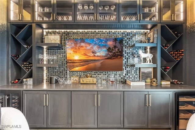 160 SW 52nd Ter, Cape Coral, FL 33914 - indoor wet bar featuring wine cooler and backsplash