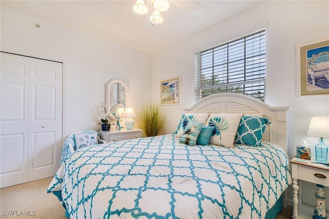 4011 Palm Tree Blvd Unit 208, Cape Coral, FL 33904 - bedroom with carpet, a closet, and a ceiling fan