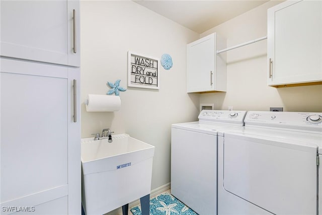4011 Palm Tree Blvd Unit 208, Cape Coral, FL 33904 - washroom with cabinet space, washer and dryer, and baseboards