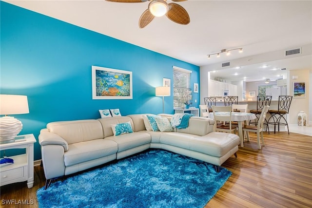 4011 Palm Tree Blvd Unit 208, Cape Coral, FL 33904 - living room featuring ceiling fan and wood finished floors