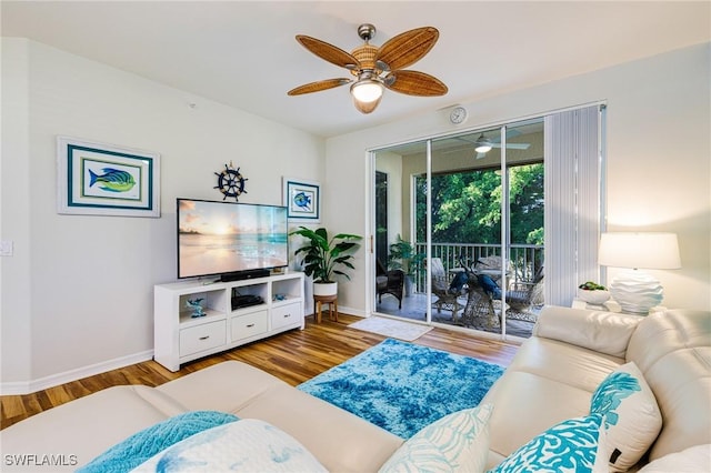 4011 Palm Tree Blvd Unit 208, Cape Coral, FL 33904 - living room featuring a ceiling fan, wood finished floors, and baseboards