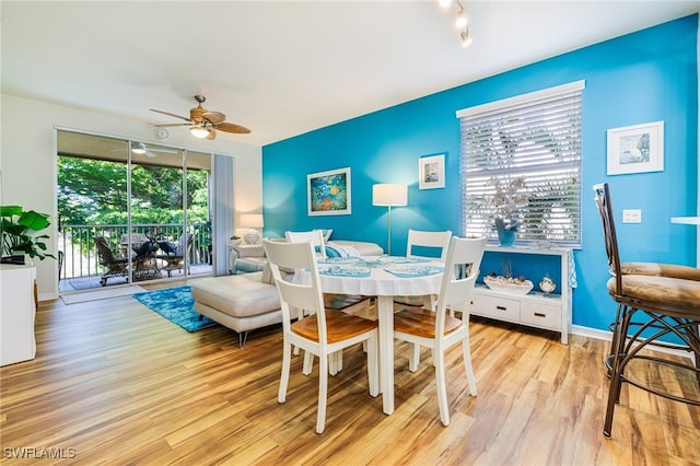 4011 Palm Tree Blvd Unit 208, Cape Coral, FL 33904 - dining area featuring wood finished floors, a ceiling fan, and baseboards