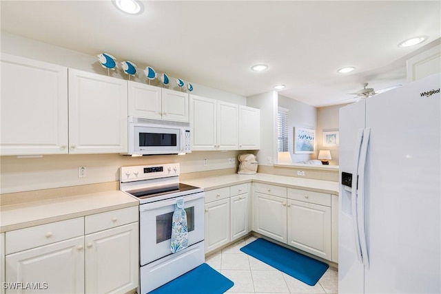 4011 Palm Tree Blvd Unit 208, Cape Coral, FL 33904 - kitchen featuring white appliances, light tile patterned floors, white cabinets, recessed lighting, and light countertops