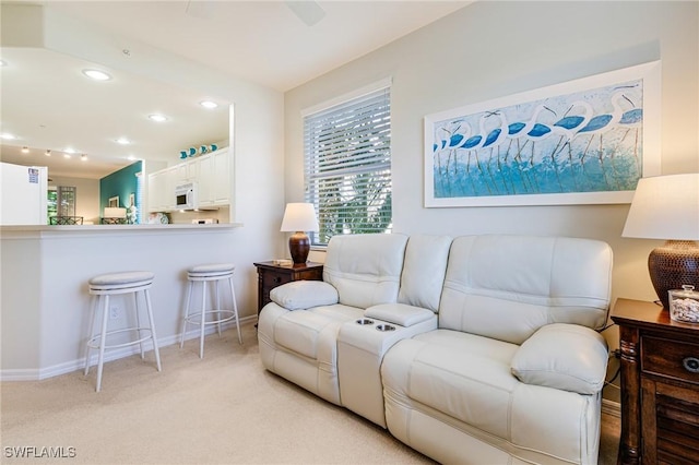 4011 Palm Tree Blvd Unit 208, Cape Coral, FL 33904 - living room featuring light carpet, recessed lighting, and baseboards