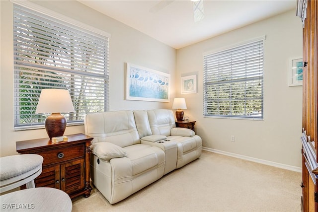 4011 Palm Tree Blvd Unit 208, Cape Coral, FL 33904 - living area featuring light colored carpet, baseboards, and a ceiling fan