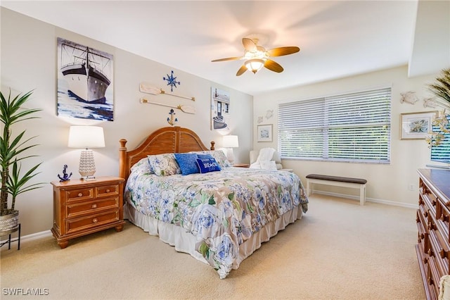 4011 Palm Tree Blvd Unit 208, Cape Coral, FL 33904 - bedroom featuring light colored carpet, a ceiling fan, and baseboards