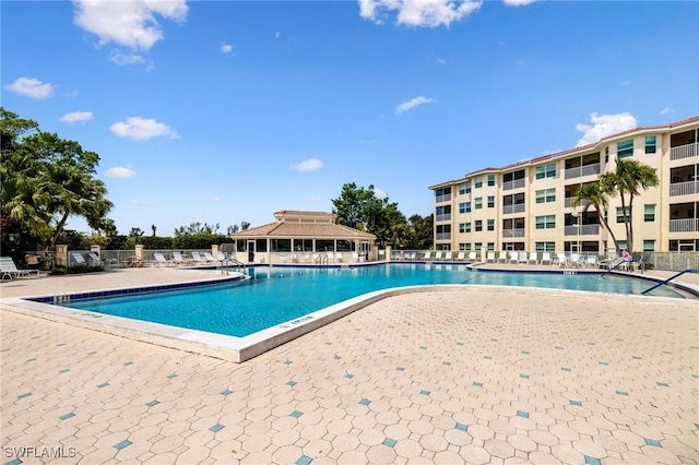 4011 Palm Tree Blvd Unit 208, Cape Coral, FL 33904 - community pool featuring a patio