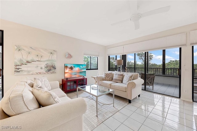 6500 Valen Way Unit A402, Naples, FL 34108 - living area featuring light tile patterned floors and ceiling fan