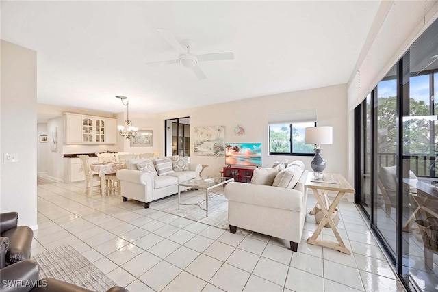 6500 Valen Way Unit A402, Naples, FL 34108 - living room with plenty of natural light, a chandelier, and a ceiling fan