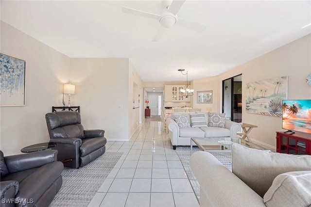 6500 Valen Way Unit A402, Naples, FL 34108 - living area with a chandelier, light tile patterned floors, baseboards, and a ceiling fan
