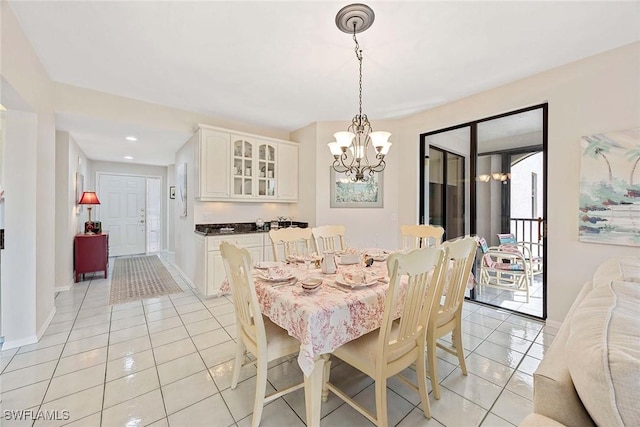 6500 Valen Way Unit A402, Naples, FL 34108 - dining area with light tile patterned flooring, a chandelier, baseboards, and recessed lighting
