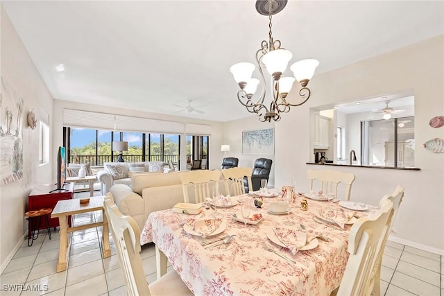 6500 Valen Way Unit A402, Naples, FL 34108 - dining area with ceiling fan, light tile patterned floors, baseboards, and a chandelier
