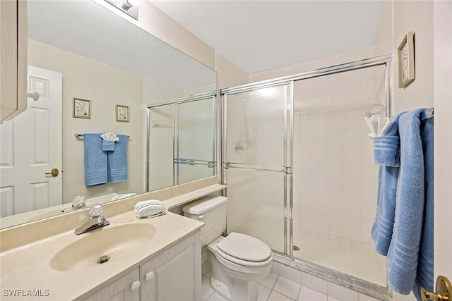 6500 Valen Way Unit A402, Naples, FL 34108 - bathroom featuring toilet, a shower stall, vanity, and tile patterned floors