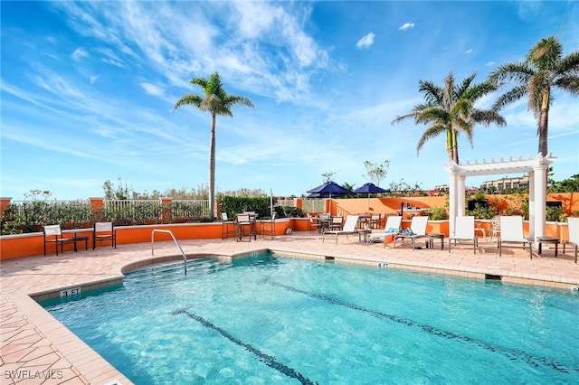 3191 Matecumbe Key Rd Unit 607, Punta Gorda, FL 33955 - community pool featuring a patio area and a pergola