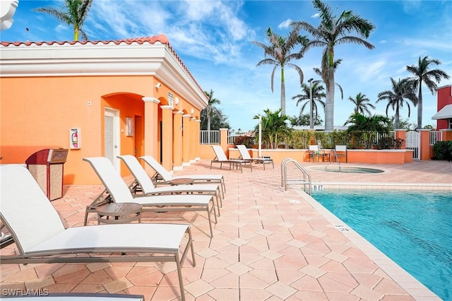 3191 Matecumbe Key Rd Unit 607, Punta Gorda, FL 33955 - community pool featuring a patio area and a hot tub