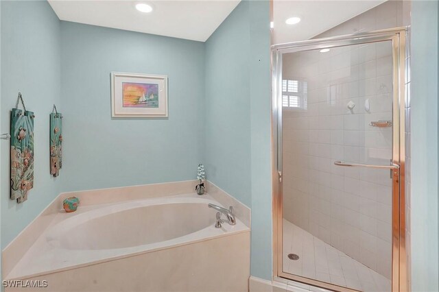 3191 Matecumbe Key Rd Unit 607, Punta Gorda, FL 33955 - full bathroom with a bath, a stall shower, and recessed lighting