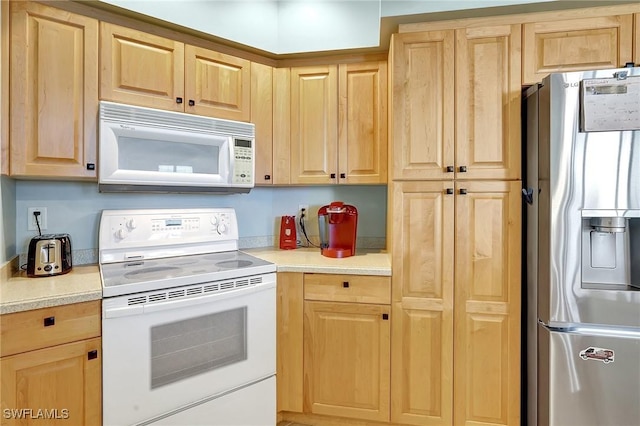 3191 Matecumbe Key Rd Unit 607, Punta Gorda, FL 33955 - kitchen with white appliances, light brown cabinets, and light countertops