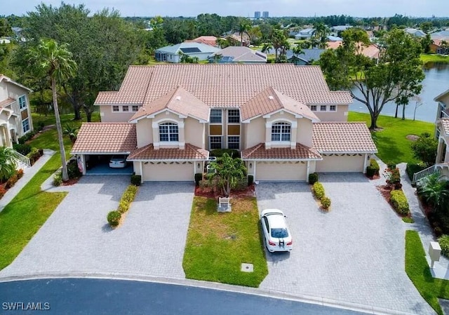 14561 Glen Cove Dr Unit 904, Fort Myers, FL 33919 - view of front of property with a tiled roof, decorative driveway, stucco siding, a garage, and a front yard