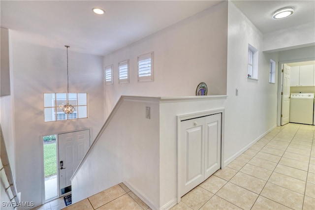 14561 Glen Cove Dr Unit 904, Fort Myers, FL 33919 - entrance foyer featuring light tile patterned floors, a chandelier, plenty of natural light, washer / clothes dryer, and recessed lighting