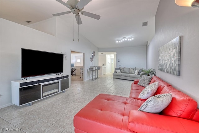14561 Glen Cove Dr Unit 904, Fort Myers, FL 33919 - living room featuring light tile patterned floors, a ceiling fan, high vaulted ceiling, and baseboards