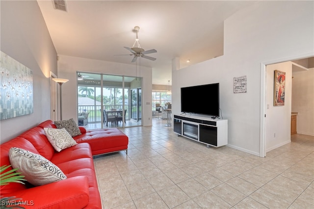 14561 Glen Cove Dr Unit 904, Fort Myers, FL 33919 - living room featuring ceiling fan, light tile patterned floors, and baseboards