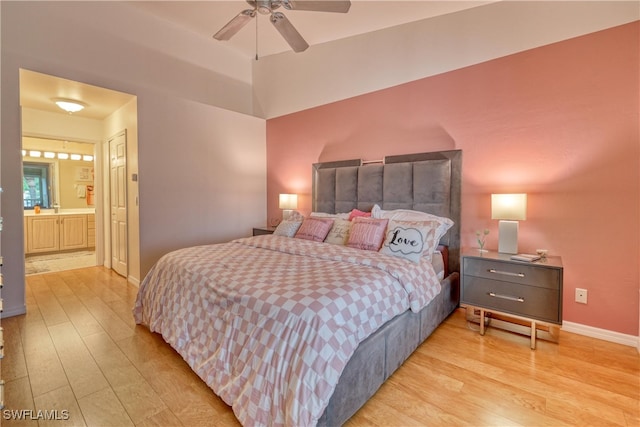 14561 Glen Cove Dr Unit 904, Fort Myers, FL 33919 - bedroom featuring light wood-style flooring, ensuite bath, baseboards, and a ceiling fan