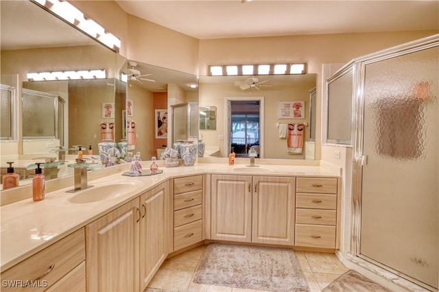 14561 Glen Cove Dr Unit 904, Fort Myers, FL 33919 - bathroom featuring ceiling fan, double vanity, a shower stall, and tile patterned floors