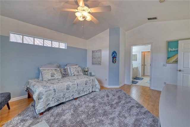 14561 Glen Cove Dr Unit 904, Fort Myers, FL 33919 - bedroom with wood finished floors, lofted ceiling, ceiling fan, baseboards, and ensuite bathroom