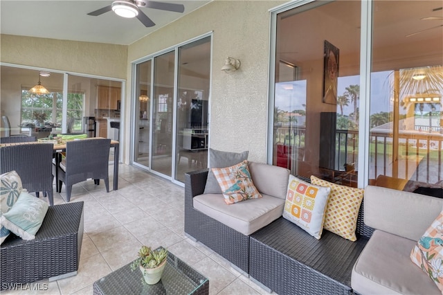 14561 Glen Cove Dr Unit 904, Fort Myers, FL 33919 - sunroom / solarium with ceiling fan, an outdoor hangout area, a textured wall, and tile patterned flooring