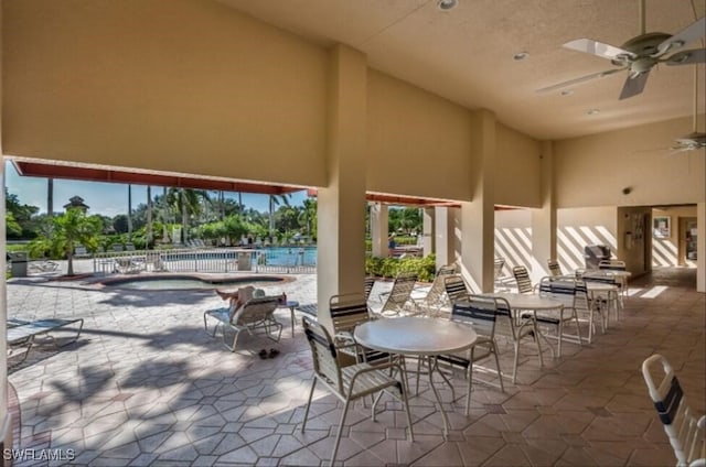 14561 Glen Cove Dr Unit 904, Fort Myers, FL 33919 - view of patio with a ceiling fan and a pool