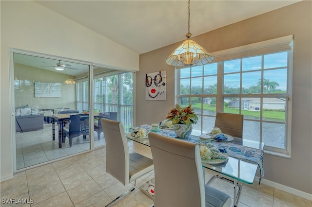 14561 Glen Cove Dr Unit 904, Fort Myers, FL 33919 - dining space featuring a chandelier, light tile patterned floors, baseboards, lofted ceiling, and ceiling fan