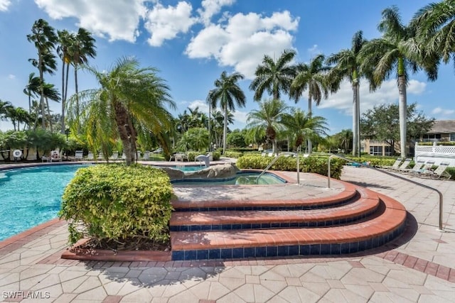 14561 Glen Cove Dr Unit 904, Fort Myers, FL 33919 - view of property's community with a jacuzzi and a pool