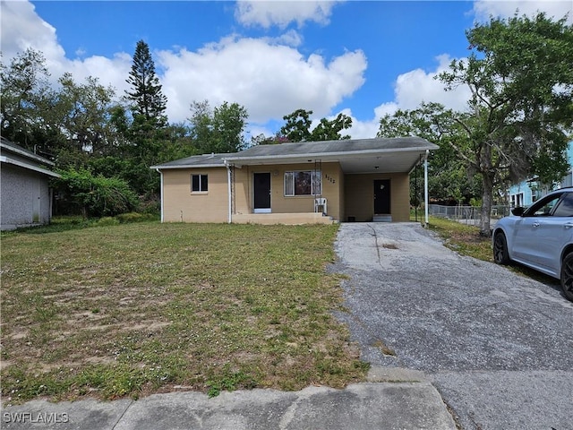 1112 Evanston St, Sebring, FL 33870 - view of front of property featuring driveway and a carport