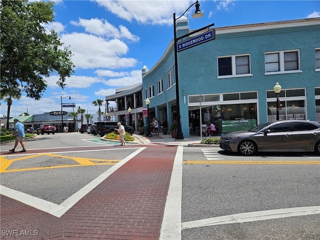 1112 Evanston St, Sebring, FL 33870 - view of asphalt road featuring street lighting, sidewalks, and curbs