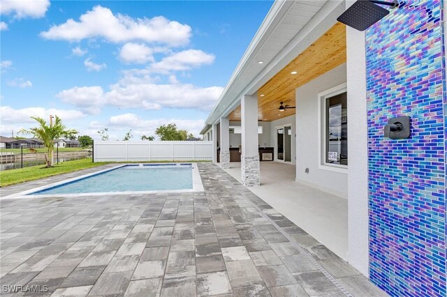 149 SE 21st St, Cape Coral, FL 33990 - view of pool featuring a fenced backyard, ceiling fan, and a patio