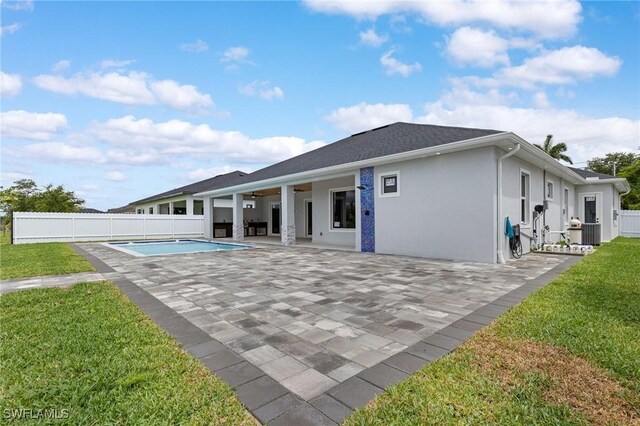149 SE 21st St, Cape Coral, FL 33990 - back of house with a patio area, a ceiling fan, and stucco siding