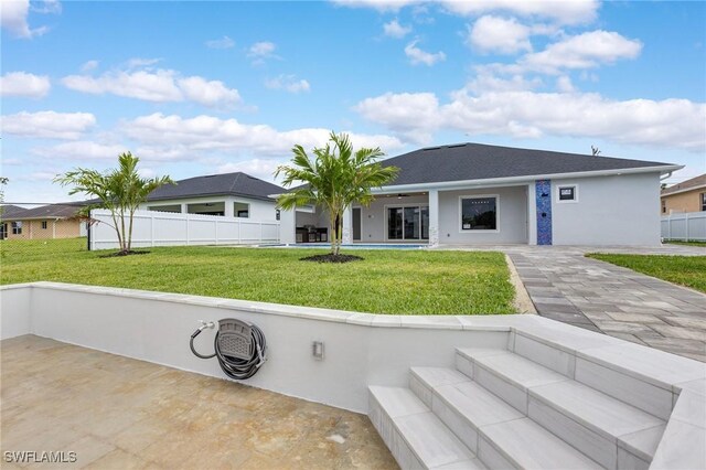 149 SE 21st St, Cape Coral, FL 33990 - rear view of house with stucco siding