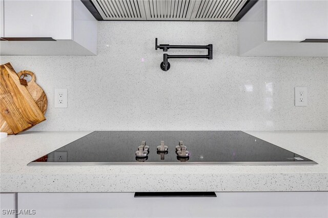 149 SE 21st St, Cape Coral, FL 33990 - kitchen view of light countertops, pot filler, and exhaust hood