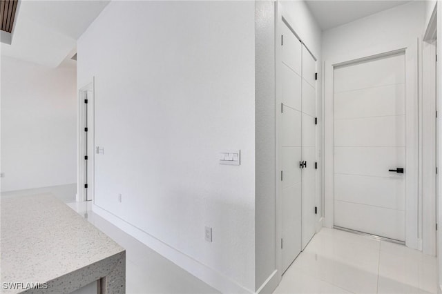149 SE 21st St, Cape Coral, FL 33990 - corridor featuring light tile patterned flooring