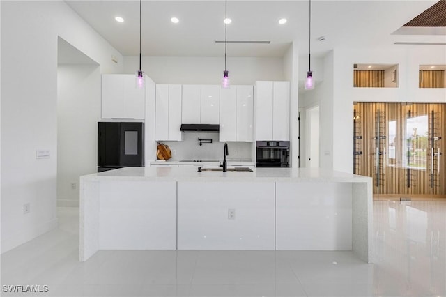 149 SE 21st St, Cape Coral, FL 33990 - kitchen featuring wall oven, refrigerator, modern cabinets, a sink, and white cabinetry