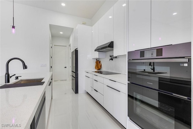149 SE 21st St, Cape Coral, FL 33990 - kitchen featuring modern cabinets, a sink, black appliances, under cabinet range hood, and recessed lighting