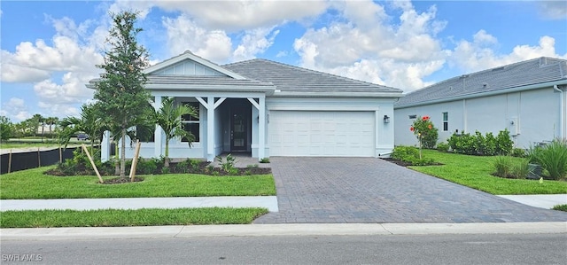 7608 Paradise Tree Dr, North Fort Myers, FL 33917 - ranch-style house with a garage, a front lawn, and decorative driveway