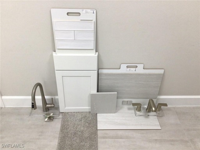 7608 Paradise Tree Dr, North Fort Myers, FL 33917 - bathroom featuring baseboards