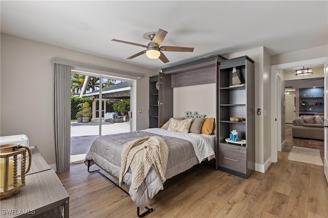 1020 SW 56th St, Cape Coral, FL 33914 - bedroom with access to outside, light wood-style floors, ceiling fan, and baseboards