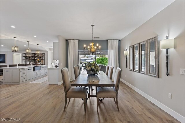 1020 SW 56th St, Cape Coral, FL 33914 - dining room with a chandelier, light wood-style floors, baseboards, and recessed lighting