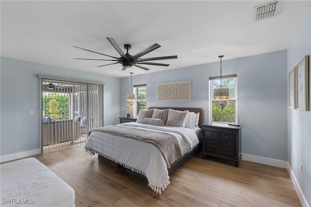 1020 SW 56th St, Cape Coral, FL 33914 - bedroom featuring light wood-style flooring, baseboards, ceiling fan, and access to outside