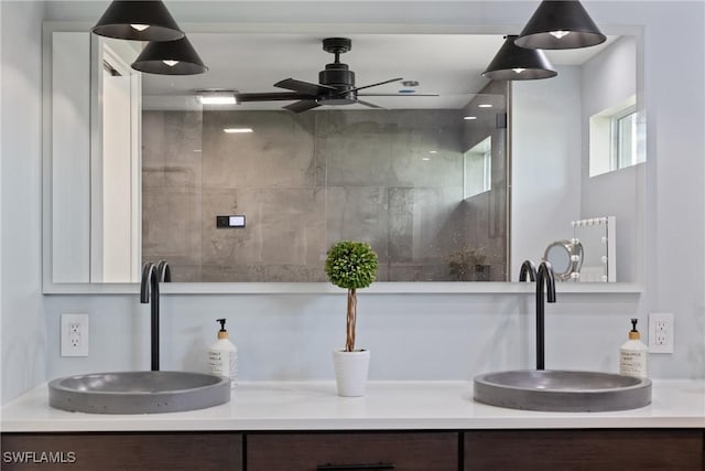 1020 SW 56th St, Cape Coral, FL 33914 - full bathroom with double vanity, ceiling fan, and a shower with door