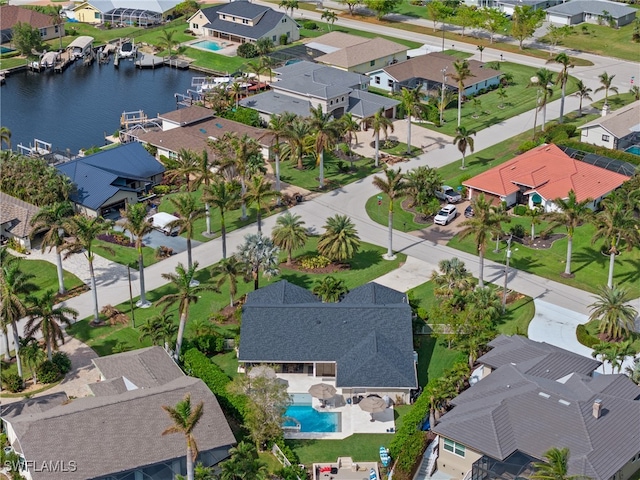 1020 SW 56th St, Cape Coral, FL 33914 - aerial perspective of suburban area with a large body of water and a pool area